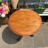 Vintage round garden table with cast iron base. Top view