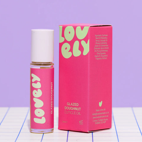 files/A_bottle_of_Lovely_Glazed_Doughnut_Cuticle_Oil_next_to_its_pink_packaging_box_set_against_a_lavender_background..webp