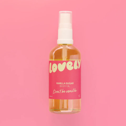 files/A_bottle_of_Lovely_Vanilla_Sugar_Body_Oil_with_a_pink_label_and_white_spray_top_centered_against_a_solid_pink_background..webp