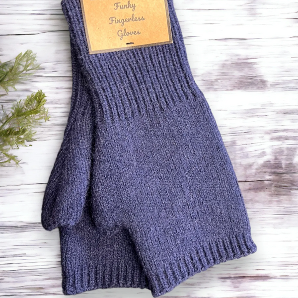 A pair of navy blue cable knit fingerless gloves displayed on a wooden surface.