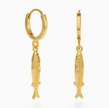 Gold fish-shaped hoop earrings on a white background