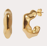 Gold hoop earrings on a light gray background