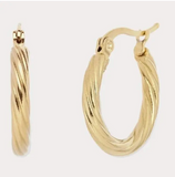 Gold hoop earrings on a light gray background