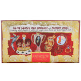 A rectangular chocolate bar package labeled 'Arthouse Unlimited' with the text 'Salted Caramel Milk Chocolate with Pistachio Pieces.' The wrapper has a red central panel with illustrated objects and a gold ornate border on a white background.