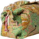 Folded fabric with leopard print and green background