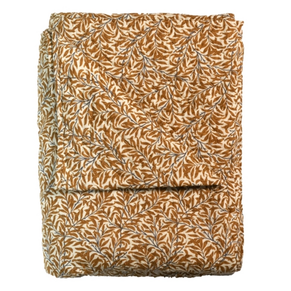 Folded fabric with a leaf pattern on a white background