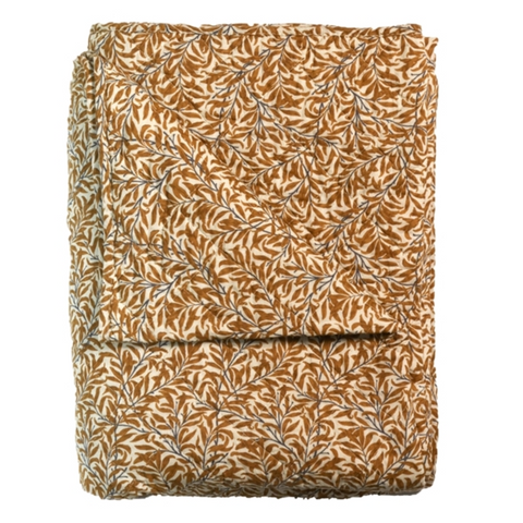 Folded fabric with a leaf pattern on a white background