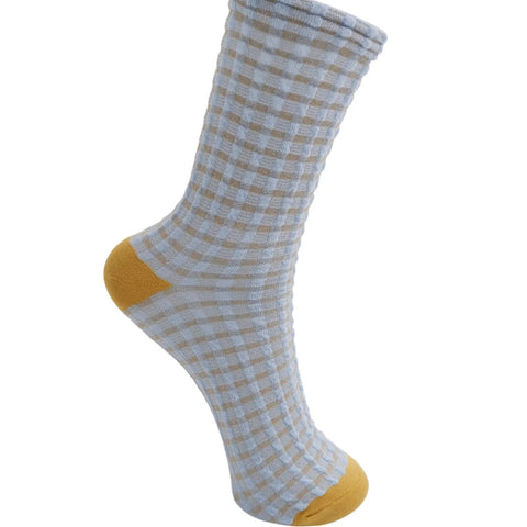 Checkered sock with yellow accents on a white background