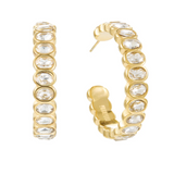 Gold hoop earrings with clear gemstones on a white background