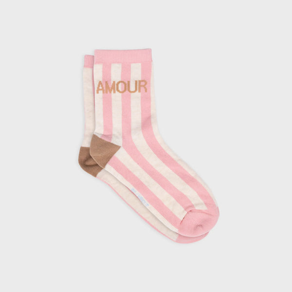 Pink socks with white stripes on a checkered background