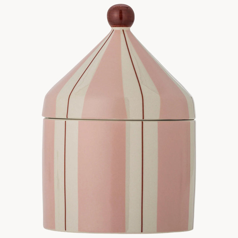 A pink and cream vertically striped ceramic lidded container with a small dark reddish-brown spherical finial on top, shown against a plain light gray background.
