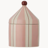 A pink and cream vertically striped ceramic lidded container with a small dark reddish-brown spherical finial on top, shown against a plain light gray background.