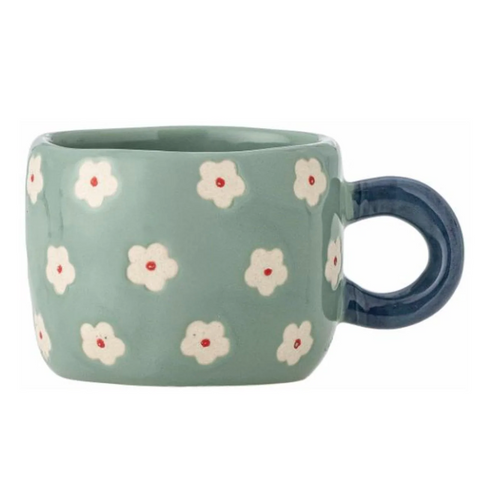 Blue mug with floral pattern on a white background