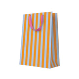 Striped paper bag with orange and blue vertical stripes and pink handles on a white background