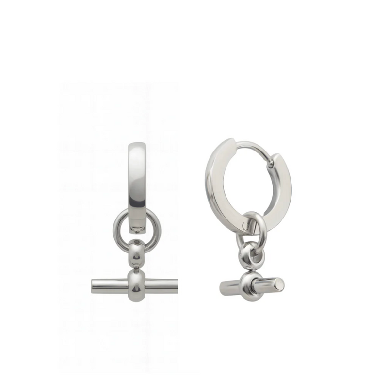 Pair of silver hoop earrings with small cylindrical charms on a white background