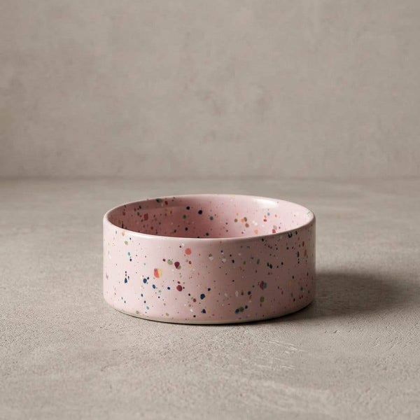 Pink terrazzo-patterned bowl on a beige background