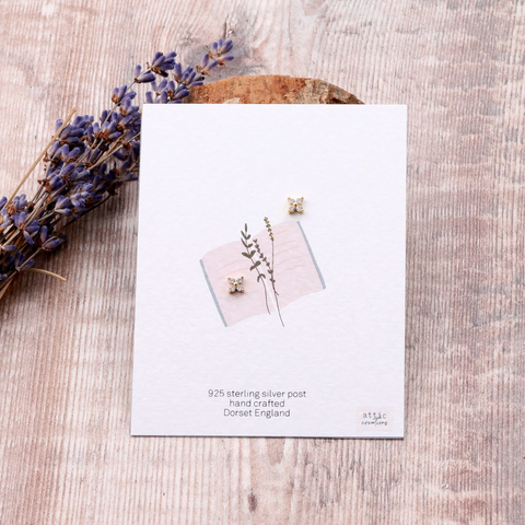 Clear crystal Inlaid in gold stud on a card 