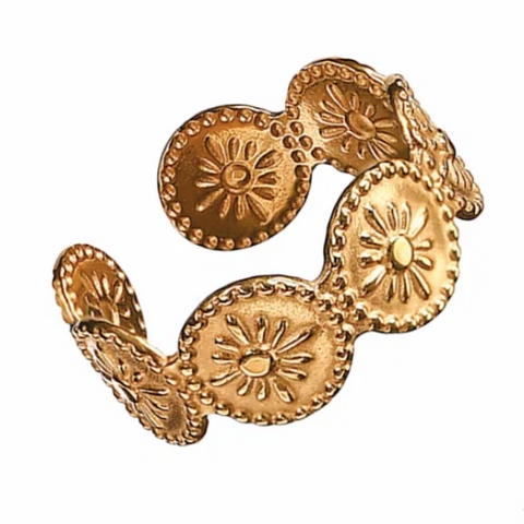 Gold bracelet with intricate design on a white background