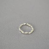 Consortium - Hammered band ring in silver.