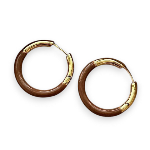 Pair of gold hoop earrings on a white background