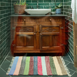 Daisy Snow Carnival Stripe Small Recycled Rug in bathroom