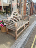 A Lutye’s style garden bench left side view