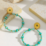 Gold earring with Aqua Hoop