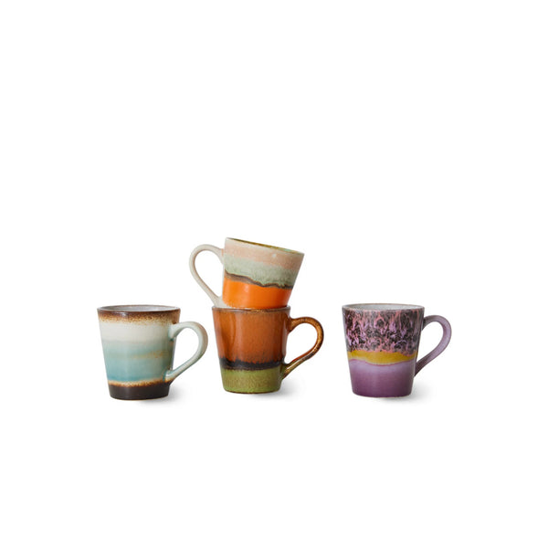 Three handmade ceramic mugs with colorful, earthy gradient bands, displayed on a clean white background.