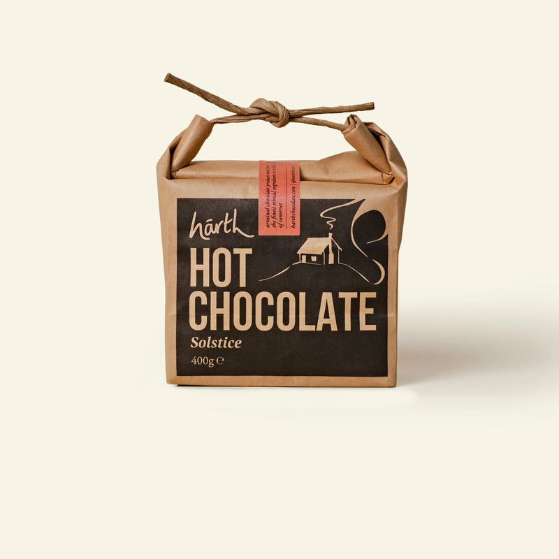 Kraft paper packaging of Harth Hot Chocolate Solstice on a beige background