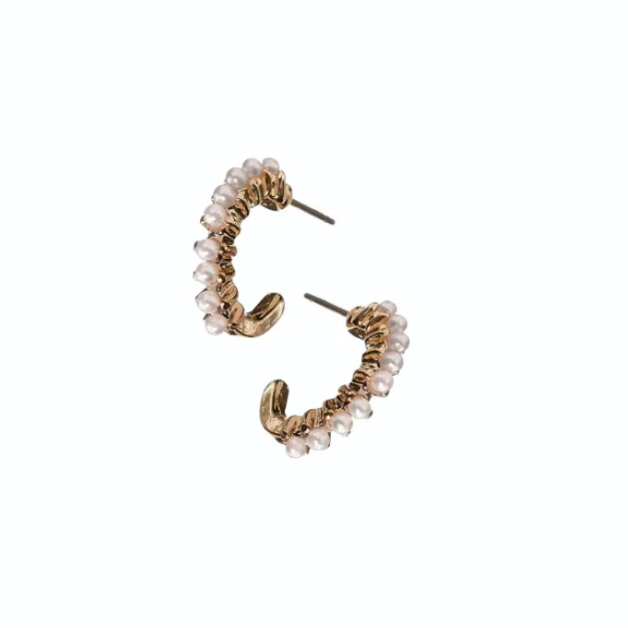 Pair of gold hoop earrings with pearl-like beads on a white background