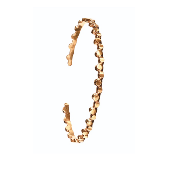 Gold bracelet with a textured design on a white background