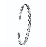 Silver bracelet with a zigzag pattern on a white background