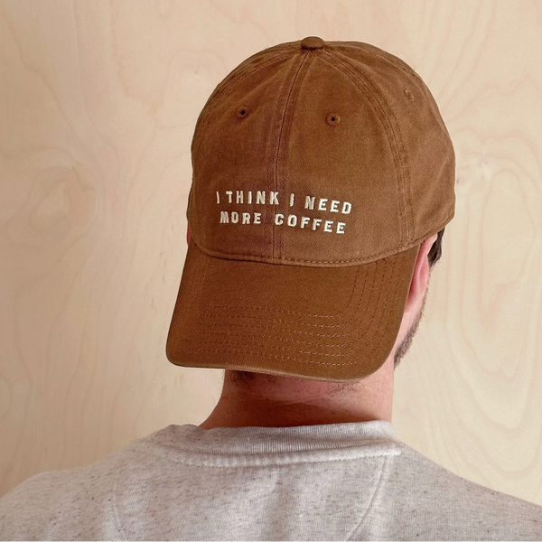 'I Think I Need More Coffee' Cotton Baseball Cap - Tan Model