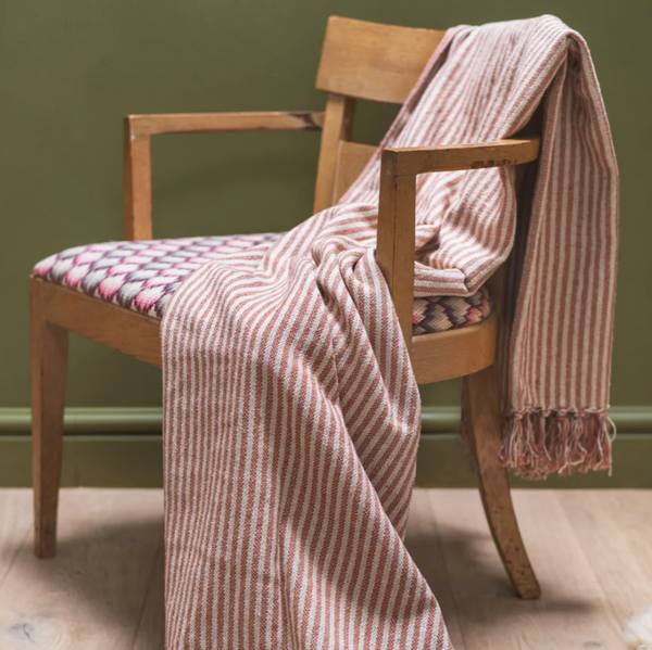 Ian Snow Pink and White Recycled Cotton Striped Throw on chair