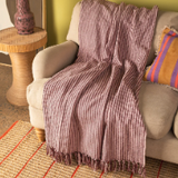 Ian Snow Plum & Dusty Rose Recycled Cotton Striped Throw on sofa