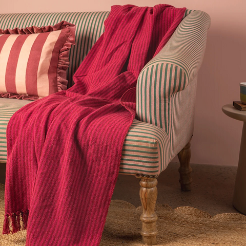 files/Ian_Snow_Red_and_Pink_Recycled_Cotton_Striped_Throw_on_sofa.png