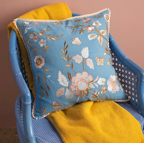 files/Ian_Snow_Sky_Blue_and_Pink_Hedgerow_Embroidered_Cushion_on_chair.png