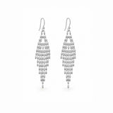 A pair of silver drop earrings with multiple tiers of small teardrop-shaped beads on a plain white background.