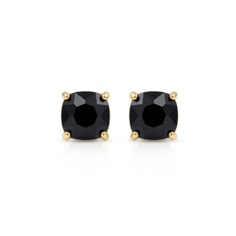 Pair of ruby and diamond earrings on a white background