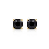 Pair of ruby and diamond earrings on a white background