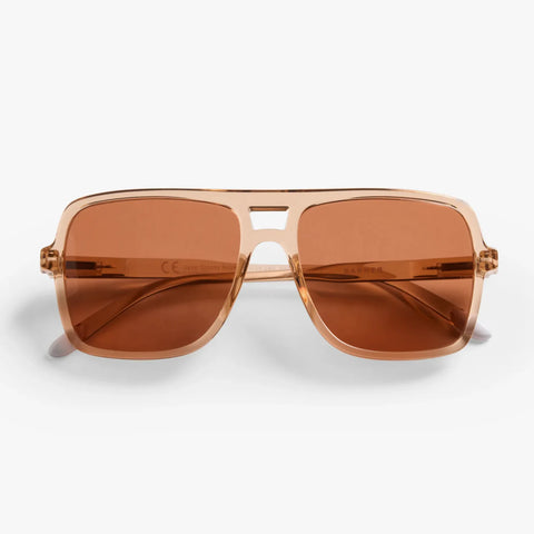 Sunglasses with brown lenses and gold frame on a white background