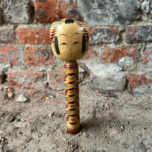 Japanese Kokeshi Dolls red and green front view