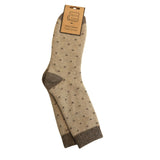 A pair of beige wool blend crew socks with dark brown polka dots and solid brown heels, toes, and cuffs, shown on a white background with a cardboard hanger.