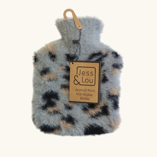 A plush faux-fur hot water bottle in an animal print pattern of gray, black, and tan, featuring a light wood hanger and a paper brand tag that reads 'Jess & Lou'.