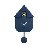 A modern house-shaped wall clock in dark navy blue with white clock hands, a gold accent ring around the pendulum window, and a matching navy blue pendulum weight, shown against a plain white background.