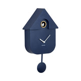 Dark blue cuckoo clock with a white face on a white background