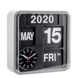 A modern square flip clock with a clear outer frame, black face, and white text showing the year 2020, the 15th of May, Friday, and AM. A small analog clock face is visible on the lower left with the brand name Karlson.