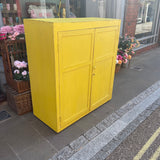 Large vintage yellow painted cupboard side view