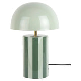 Green table lamp with a white shade on a white background
