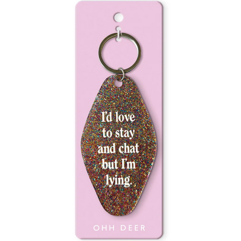 Keychain with 'I'd love to stay and chat but I'm lying' text on a pink card, brand 'OH DEER' visible